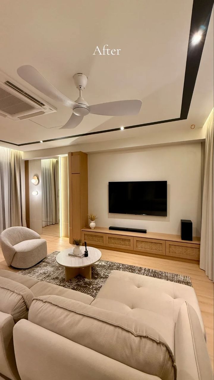Landed home living area with warm wood TV console, sofa and ceiling fan — view 7