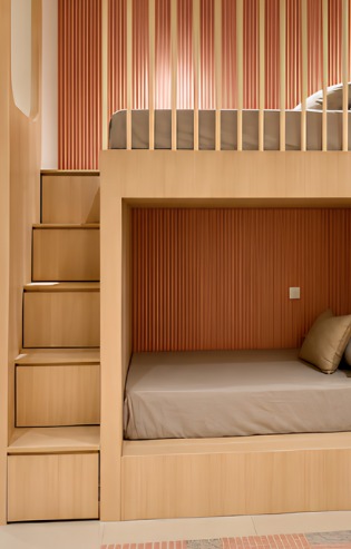 Built-in bunk bed with storage stairs and warm wood finish — view 2