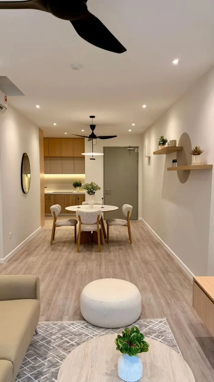 Finished condo living room with beige sofa, marble coffee table and backlit feature wall — view 1