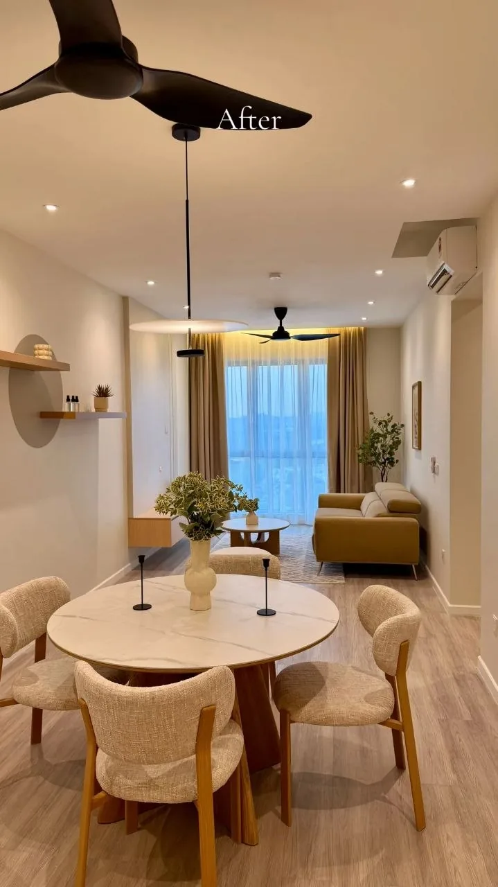 Finished condo living room with beige sofa, marble coffee table and backlit feature wall — view 3