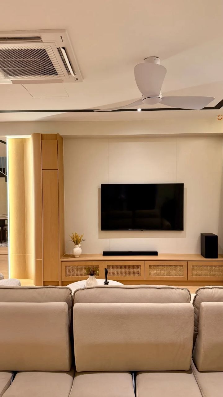 Landed home living area with warm wood TV console, sofa and ceiling fan — view 4