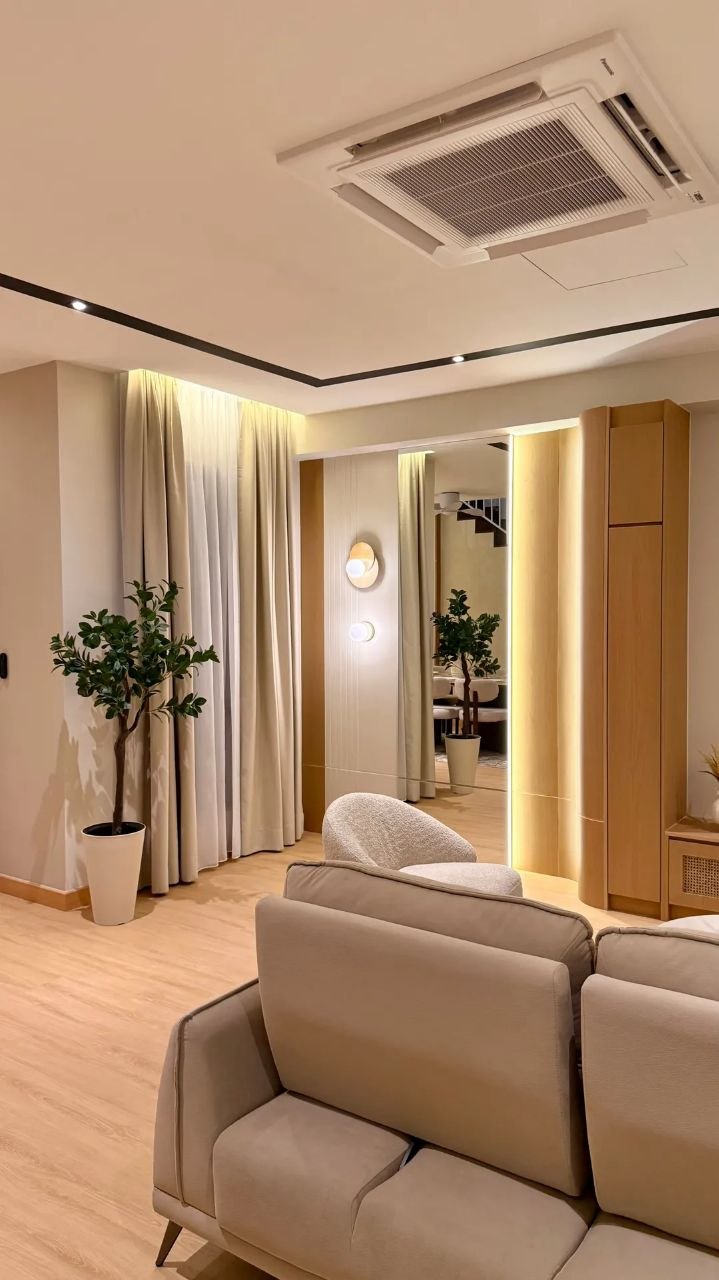 Landed home living area with warm wood TV console, sofa and ceiling fan — view 5