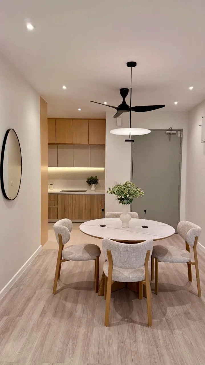 Finished condo living room with beige sofa, marble coffee table and backlit feature wall — view 5