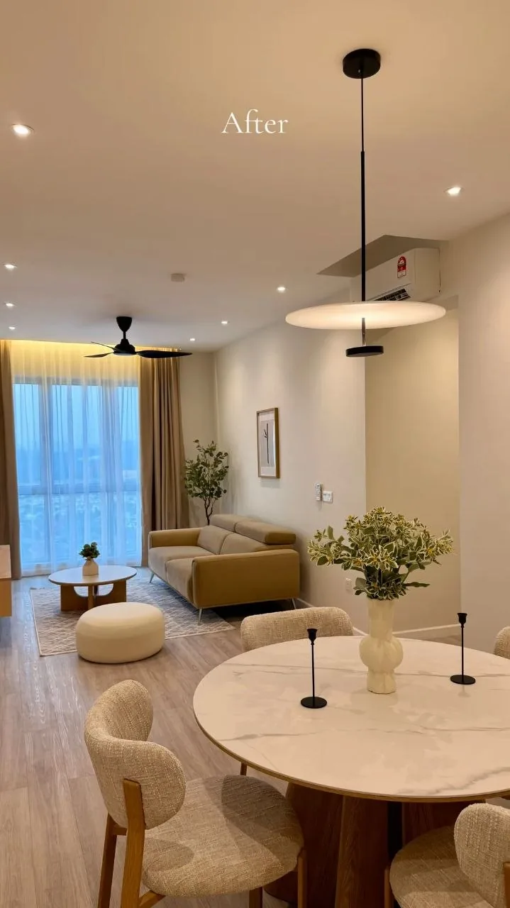 Finished condo living room with beige sofa, marble coffee table and backlit feature wall